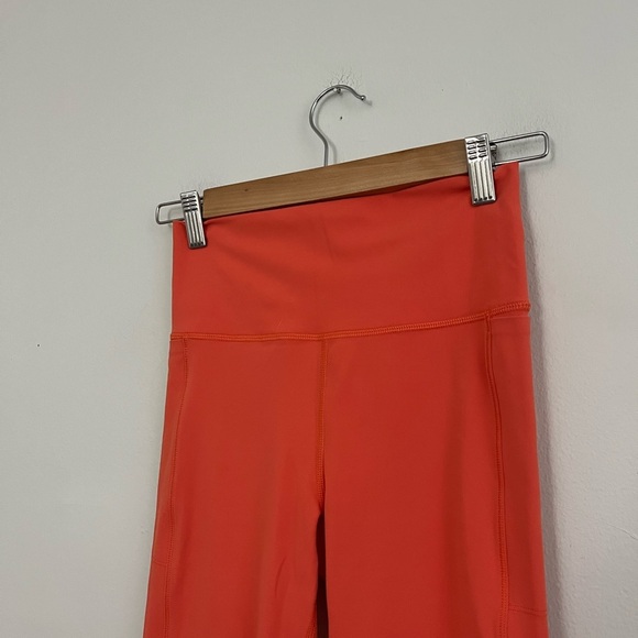 Vuori Pocket Grapefruit Orange Leggings - Picture 3 of 6